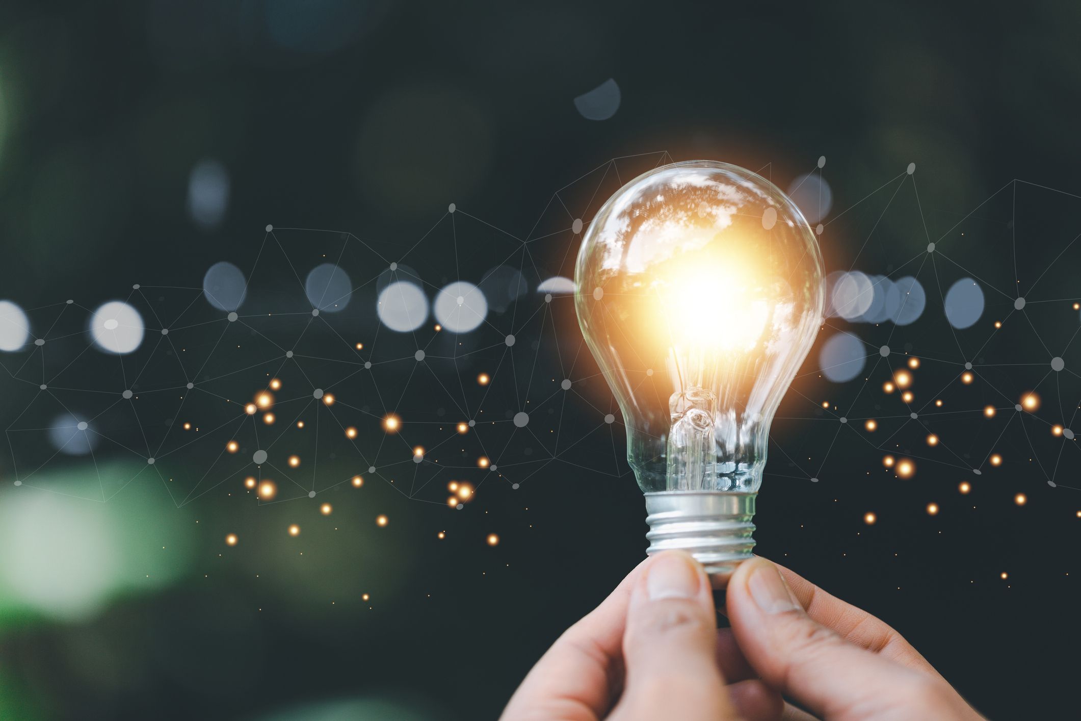 Glowing light bulb symbolizing clean, green, and renewable energy innovation